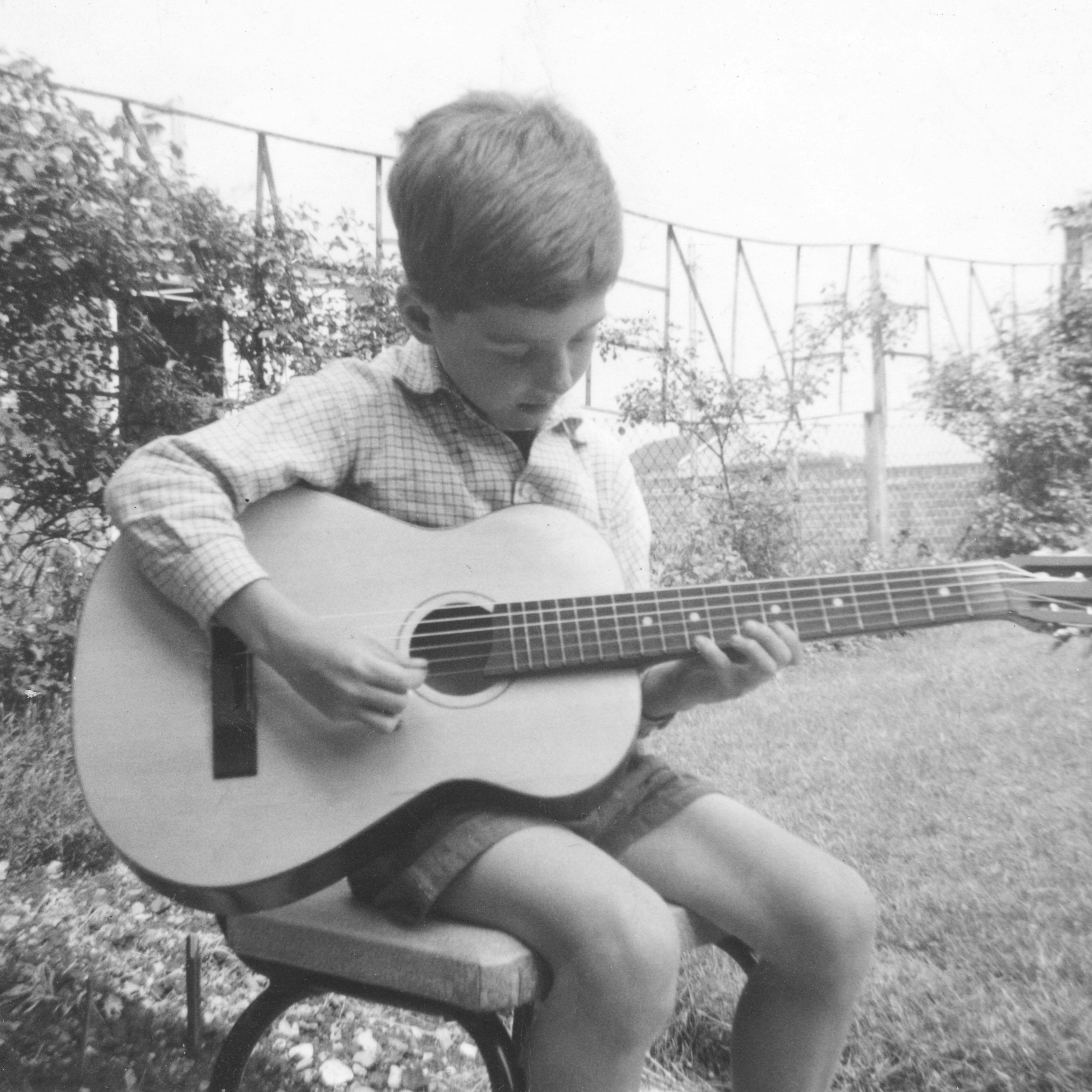 Martin Taylor as a kid playing the guitar